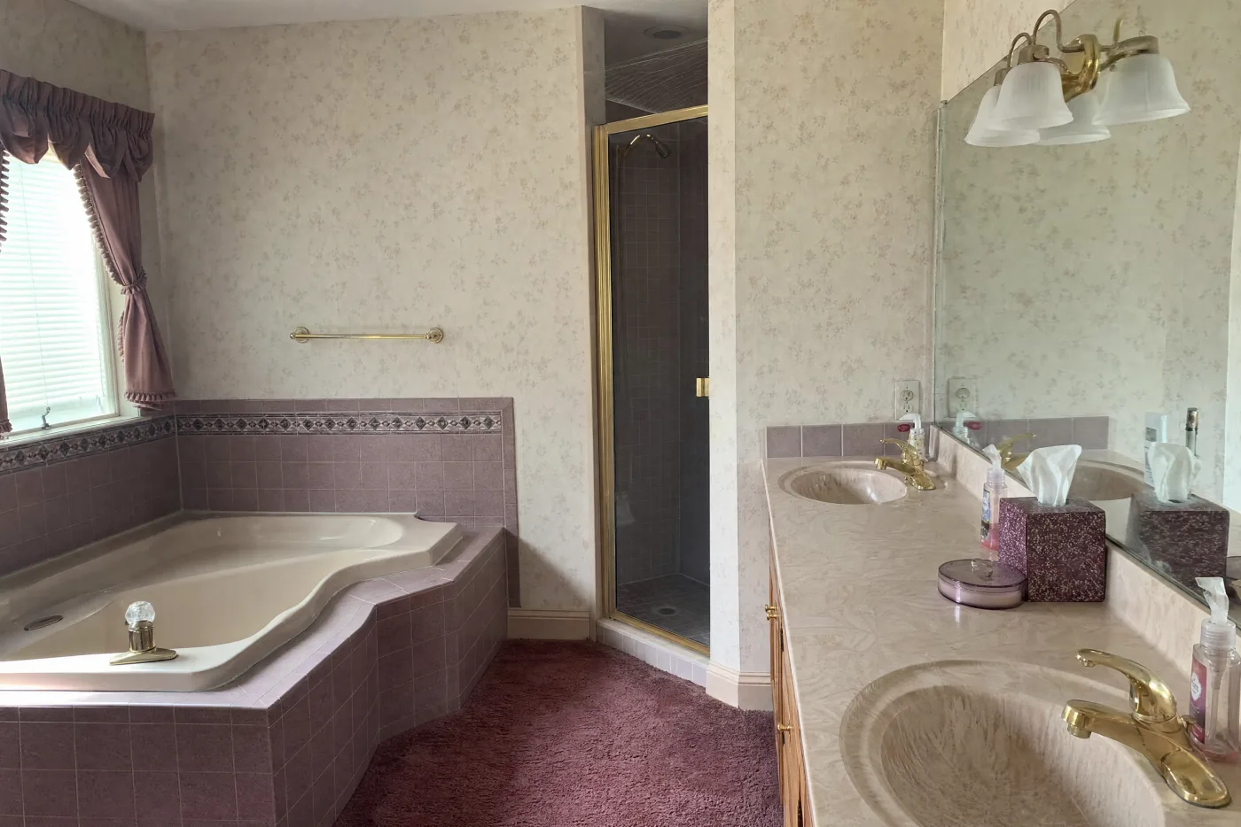 Dated mauve master bathroom before remodel