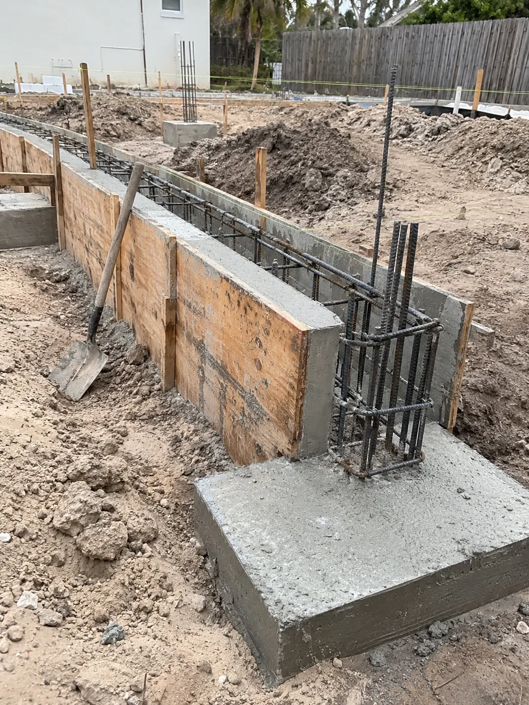 Concrete footing and grade beam formed with tied rebar before the pour